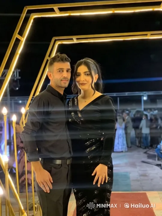 Couple Under Golden Arch in Festive Night Setting – AI Generated Video | Hailuo AI
