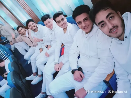 Young Men in White Discuss Energetically in Bright Room – AI Generated Video | Hailuo AI