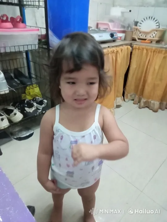 Joyful Child Dancing and Mimicking Kungfu in Kitchen – AI Generated Video | Hailuo AI
