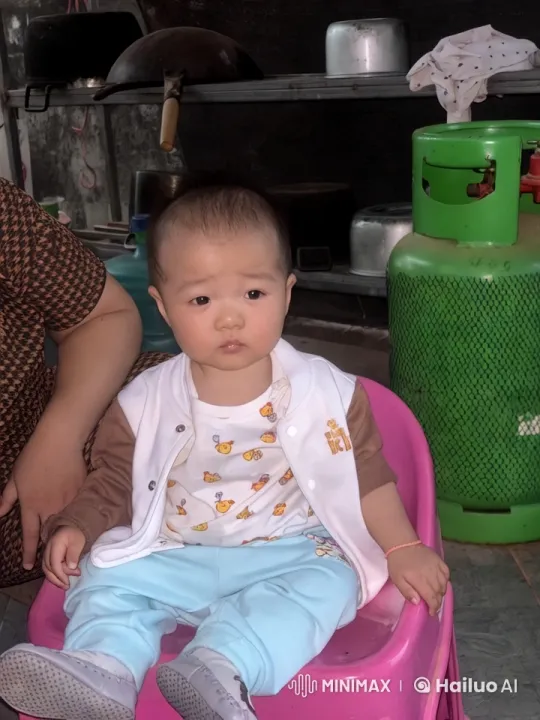 Child Enacts Playful Kungfu in Kitchen Setting – AI Generated Video | Hailuo AI
