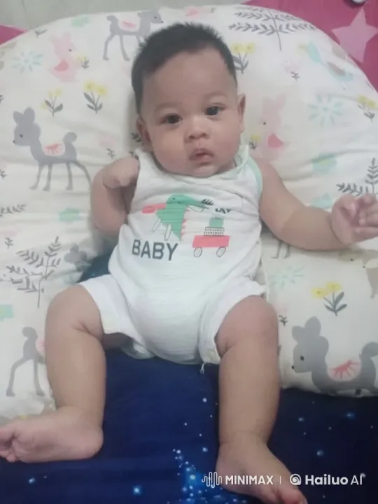 Baby Dancing Joyfully on Colorful Pillow – AI Generated Video | Hailuo AI