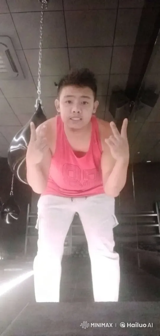 Dancer Moves Energetically in Dimly Lit Gym – AI Generated Video | Hailuo AI