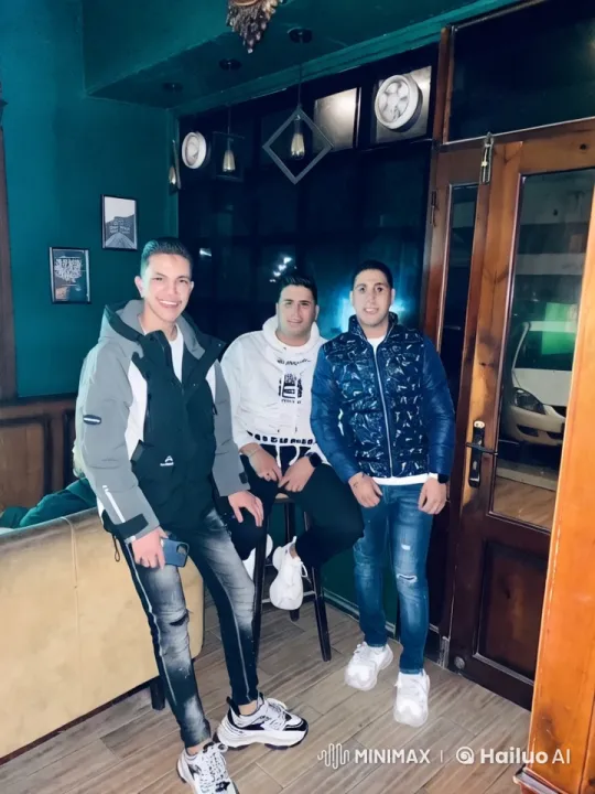 Three Young Men in Cozy Room Argue and Dance – AI Generated Video | Hailuo AI