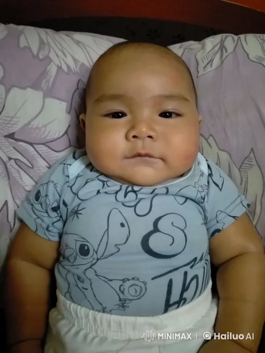 Baby with Stitch Onesie Plays Guitar on Floral Pillow – AI Generated Video | Hailuo AI