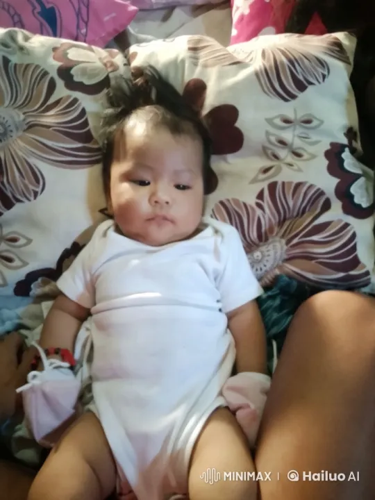 Baby's Joyful Dance in a Floral Bed Setting – AI Generated Video | Hailuo AI