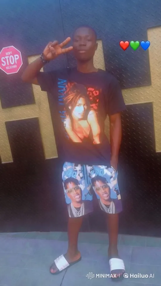 Young Man Poses with Peace Sign in Stylish Outfit – AI Generated Video | Hailuo AI