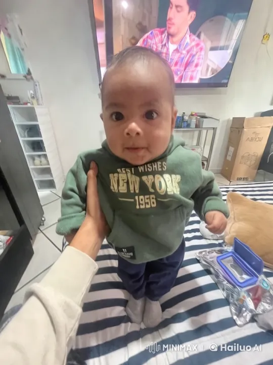 Child in 'Best Wishes New York 1956' Sweatshirt in Modern Living Room – AI Generated Video | Hailuo AI