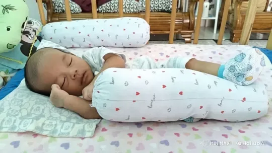 Baby Dancing Playfully on Colorful Bed – AI Generated Video | Hailuo AI