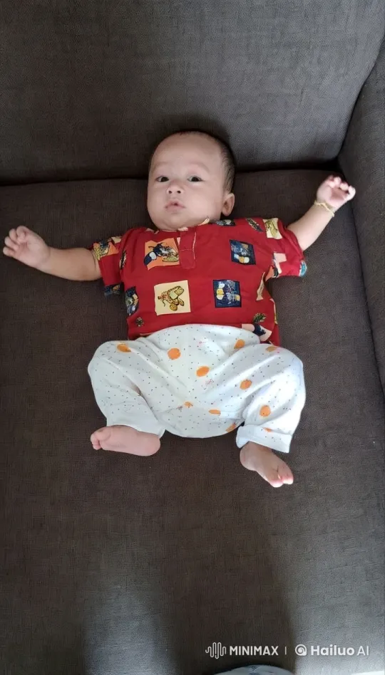 Baby Dances Joyfully on Couch in Colorful Outfit – AI Generated Video | Hailuo AI