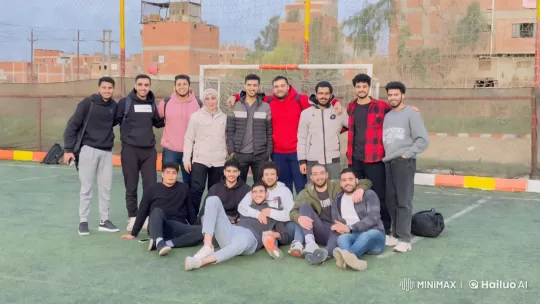 Friends Enjoying a Playful Scuffle and Dance on a Soccer Field – AI Generated Video | Hailuo AI