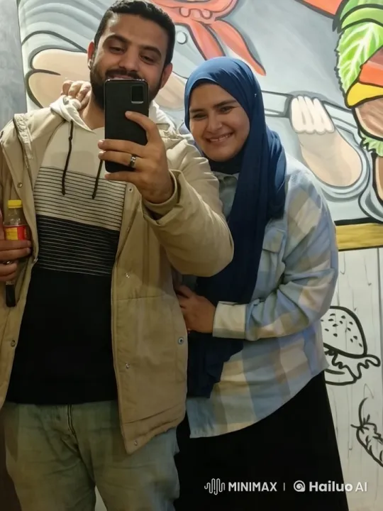 Couple Playfully Collides in Front of Vibrant Mural – AI Generated Video | Hailuo AI