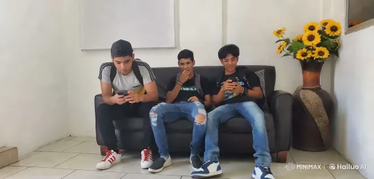 Young Men Share Kiss on Couch in Intimate Setting – AI Generated Video | Hailuo AI