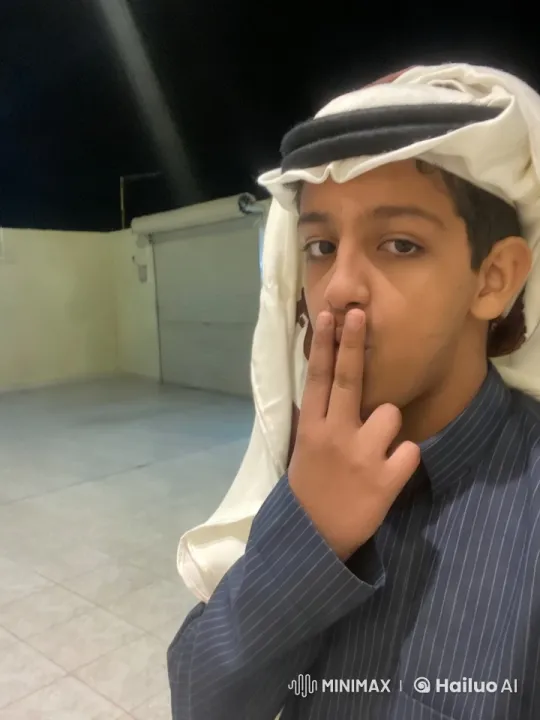 Young Man Contemplates in Night Courtyard – AI Generated Video | Hailuo AI