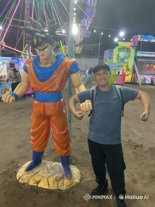 Amusement Park: Goku Statue Comes to Life in Energetic Encounter – AI Generated Video | Hailuo AI