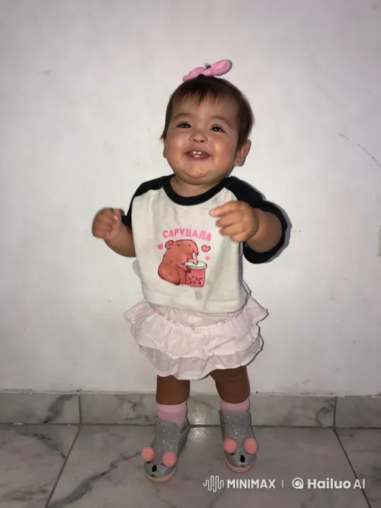 Baby Girl Showcases Cute Outfit in White Marble Setting – AI Generated Video | Hailuo AI