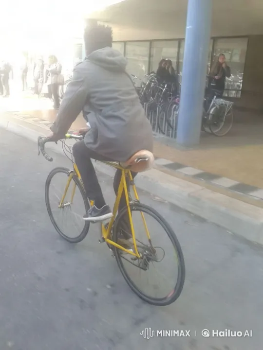 Urban Cyclist Tracking Shot in City Landscape – AI Generated Video | Hailuo AI