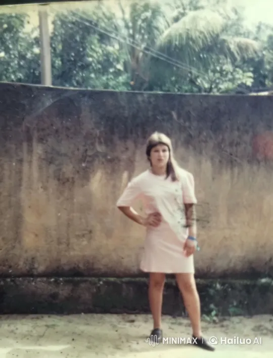 Young Woman Poses Confidently Against Rustic Outdoor Wall – AI Generated Video | Hailuo AI