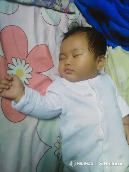 Baby's Playful Kung Fu Routine on Floral Bedspread – AI Generated Video | Hailuo AI