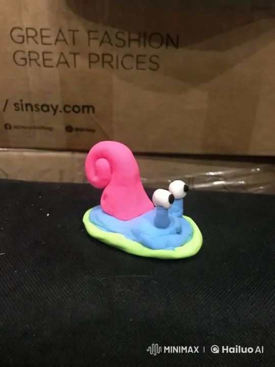 Animated Clay Snail Promotes Fashion Brand with Charm – AI Generated Video | Hailuo AI
