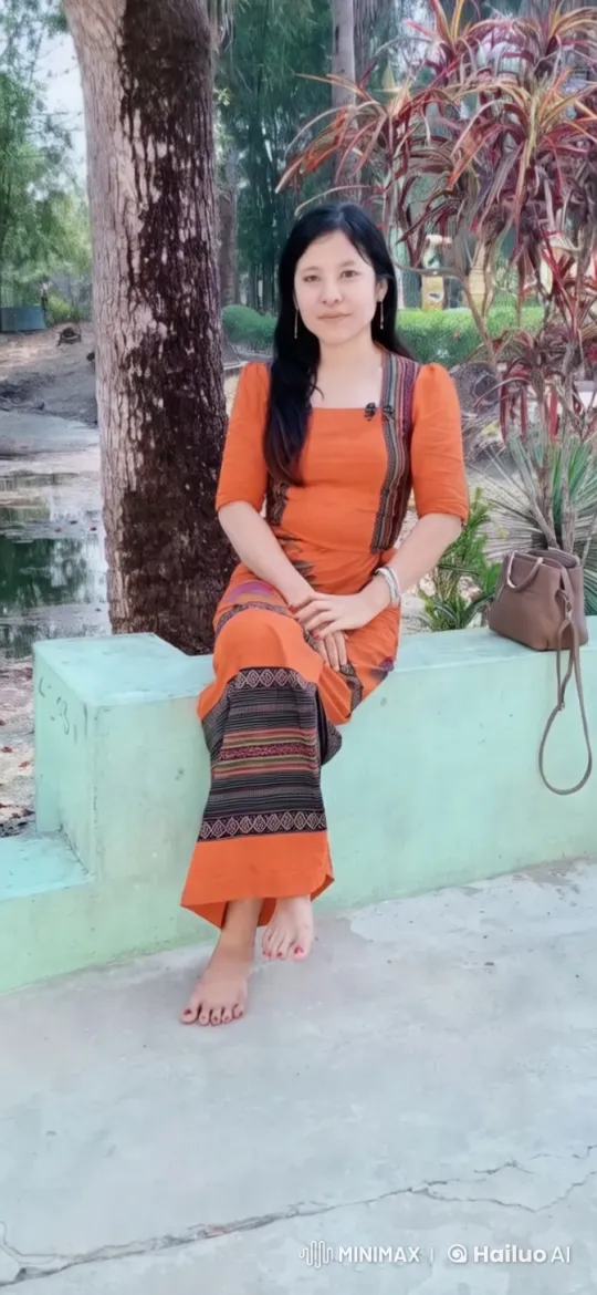 Woman in Orange Dress on Mint-Green Bench – AI Generated Video | Hailuo AI