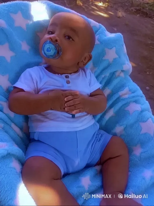 Serene Baby on Star-Adorned Blanket in Nature – AI Generated Video | Hailuo AI