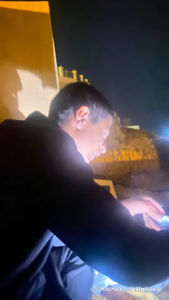 Young Man Smoking in Dimly Lit Outdoor Scene – AI Generated Video | Hailuo AI