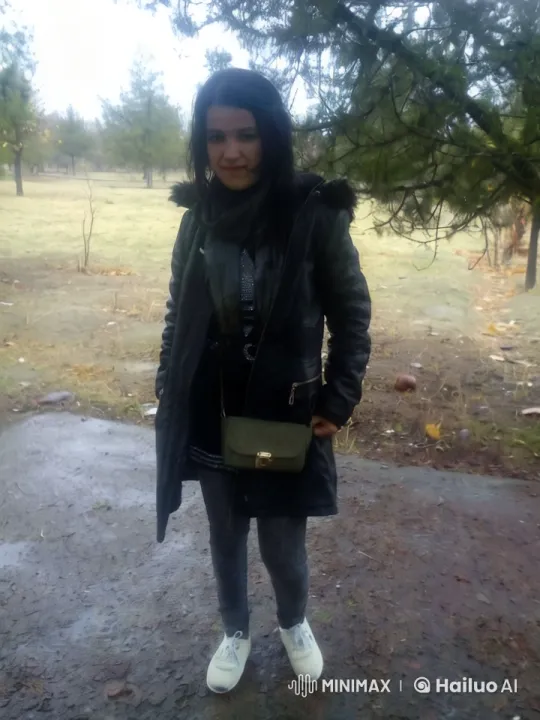 Autumnal Park Scene with Woman in Dark Attire – AI Generated Video | Hailuo AI