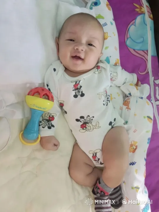 Baby's Energetic Play with Mickey Onesie and Rattle – AI Generated Video | Hailuo AI
