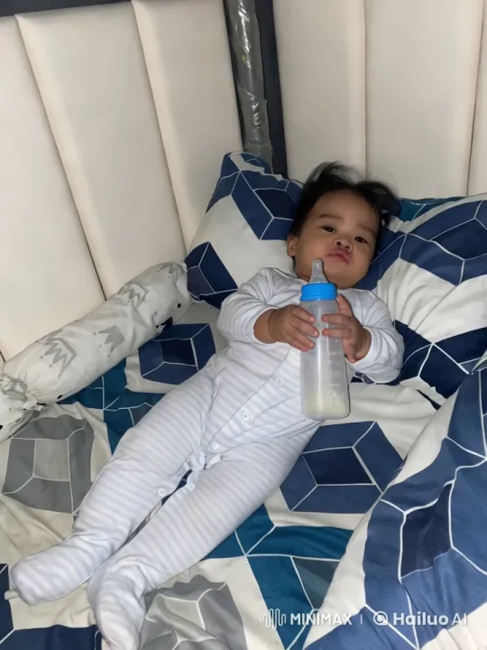 Baby Dancing on Bed with Striped Onesie – AI Generated Video | Hailuo AI