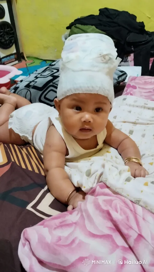 Baby Adorned with Bangles in Cozy, Colorful Bed – AI Generated Video | Hailuo AI