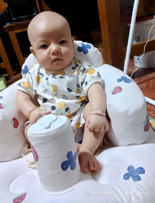 Baby Dancing Joyfully in Colorful Strawberry Chair – AI Generated Video | Hailuo AI