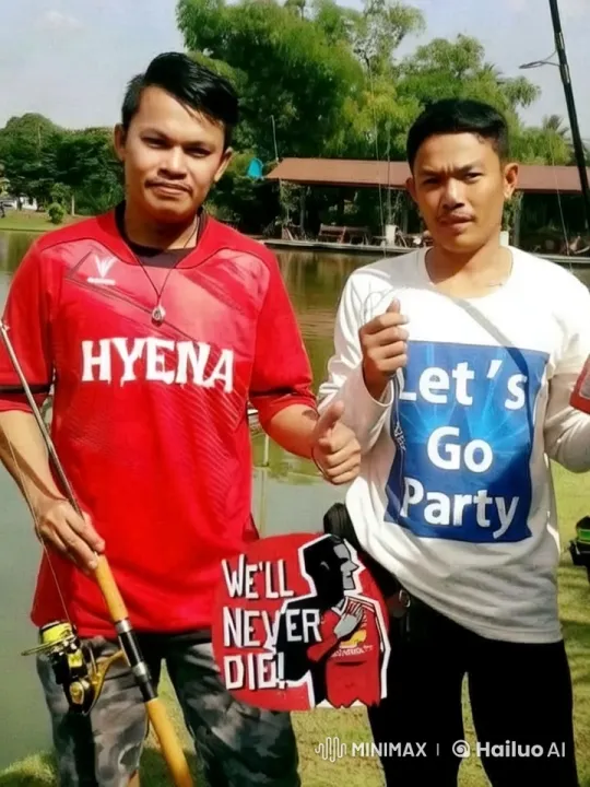 Dancing Duo by Lake with 'We'll Never Die!' Signs – AI Generated Video | Hailuo AI