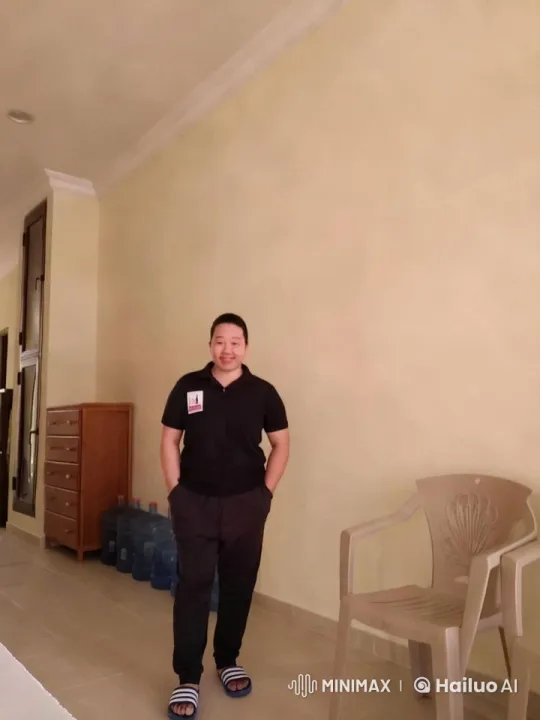 Young Man in Clean Hallway Examines Surroundings – AI Generated Video | Hailuo AI