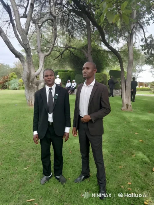 Formal Men Walk Purposefully Across Lush Lawn – AI Generated Video | Hailuo AI