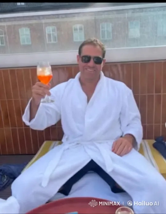 Man Toasts with Aperol Spritz on Terrace – AI Generated Video | Hailuo AI