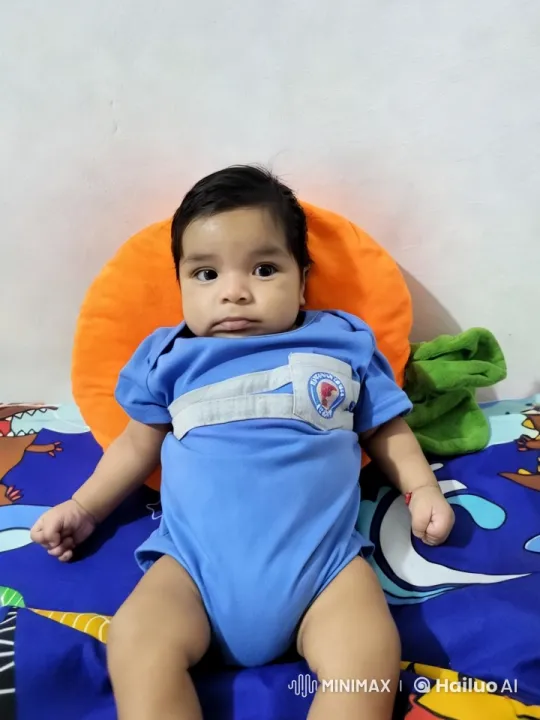 Baby Dancing Joyfully on Colorful Bedspread – AI Generated Video | Hailuo AI