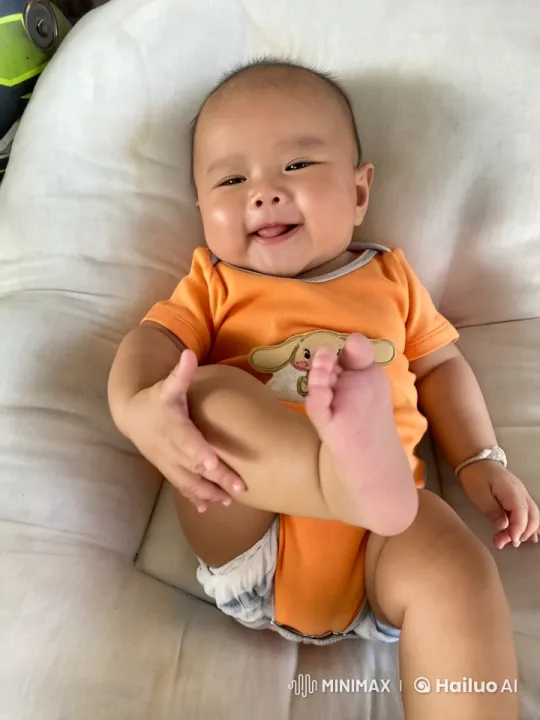 Baby Dancing and Playfully Punching on White Cushion – AI Generated Video | Hailuo AI