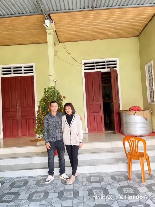 Couple Performs Impressive Kung Fu in Front of Decorated House – AI Generated Video | Hailuo AI
