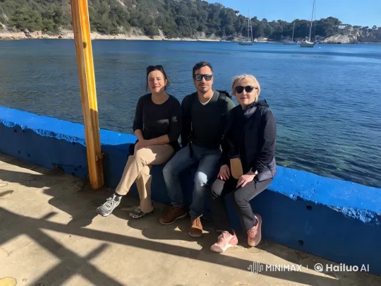 Tranquil Coastal Scene with Seated Individuals – AI Generated Video | Hailuo AI