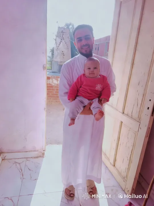 Father and Baby in Sunlit Doorway – AI Generated Video | Hailuo AI