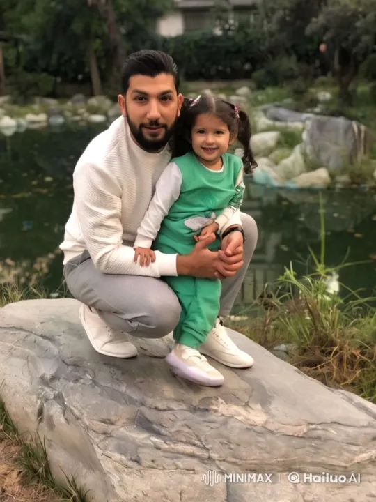 Man and Girl Dance Joyfully on Rock by Pond – AI Generated Video | Hailuo AI