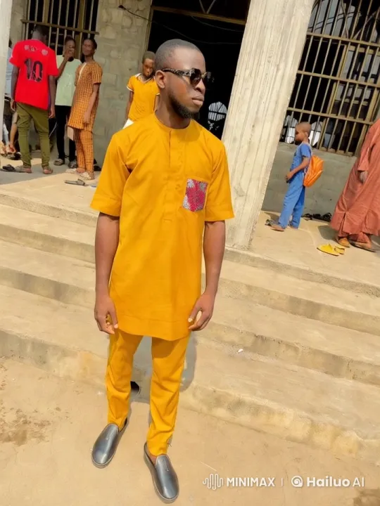 Young Man in Traditional Yellow Outfit with Vibrant Background – AI Generated Video | Hailuo AI
