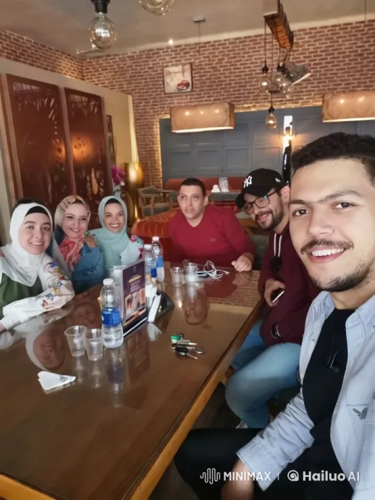 Friends Celebrate and Dance in Cozy Café Setting – AI Generated Video | Hailuo AI