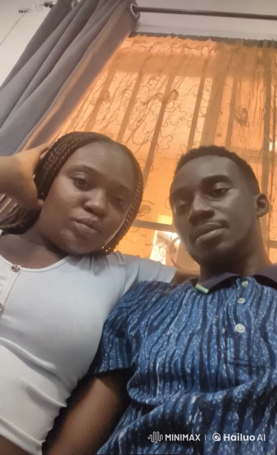 Couple's Intimate Moment in Sunlit Room with Floral Quilt – AI Generated Video | Hailuo AI