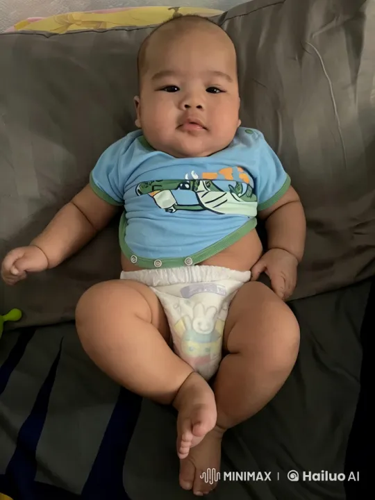 Baby's Playful Kicks and Punches on Bed – AI Generated Video | Hailuo AI