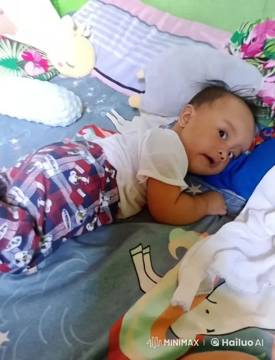 Baby Practicing Kungfu on Colorful Bed – AI Generated Video | Hailuo AI