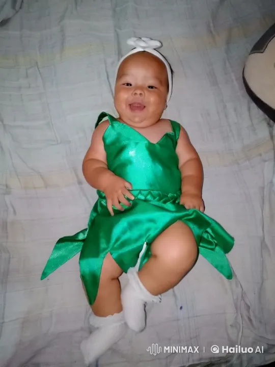 Baby Dances in Green Costume on Bed – AI Generated Video | Hailuo AI