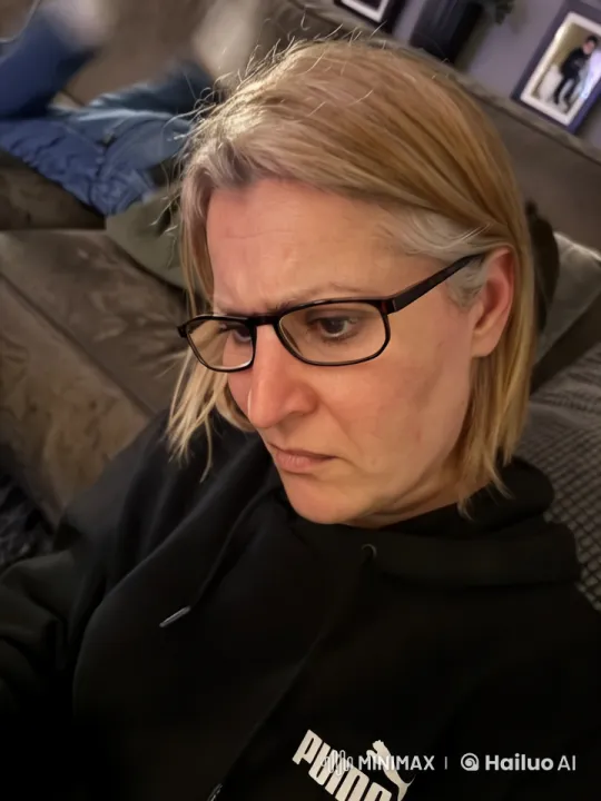 Cozy Living Room with Person in Puma Hoodie – AI Generated Video | Hailuo AI