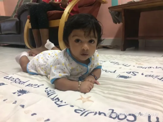 Baby Dancing Playfully on Patterned Mat – AI Generated Video | Hailuo AI
