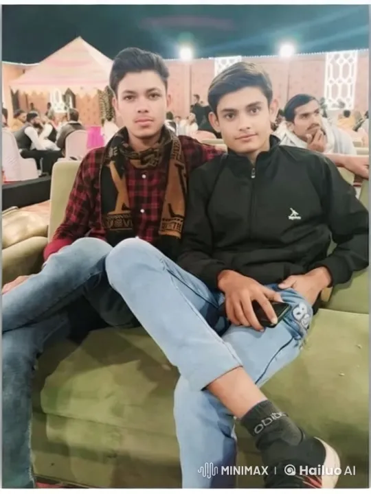 Festive Friendship: Two Men on a Sofa in a Crowd – AI Generated Video | Hailuo AI